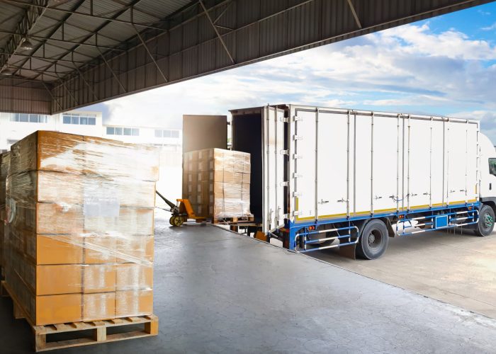 Container Trucks Parked Loading Package Boxes Pallets at Warehouse Dock. Supply Chain, Distribution Warehouse Shipping, Supplies Shipment Boxes. Freight Truck Logistic, Cargo Transport.